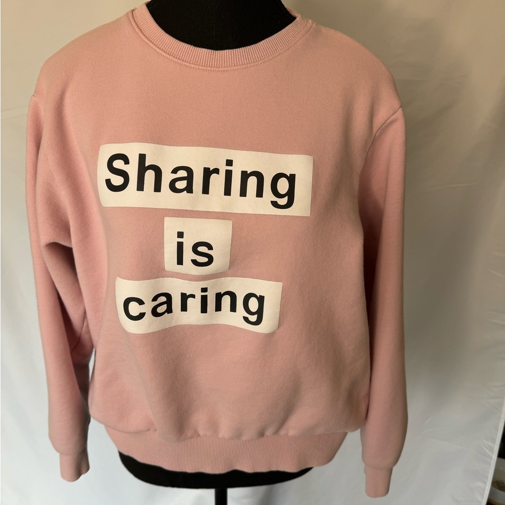 Othermix “Sharing is Caring” pink crewneck sweater